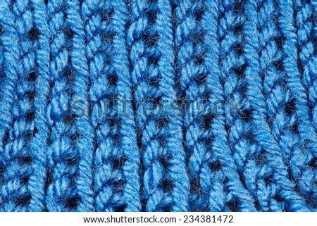 Knit woolen blue cloth macro background