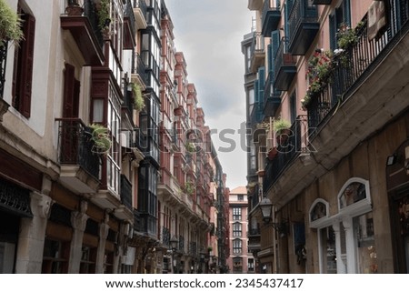 Traditional architecture apartment buildings in narrow pedestrian streets of old town city centre in Bilbao in Spain
