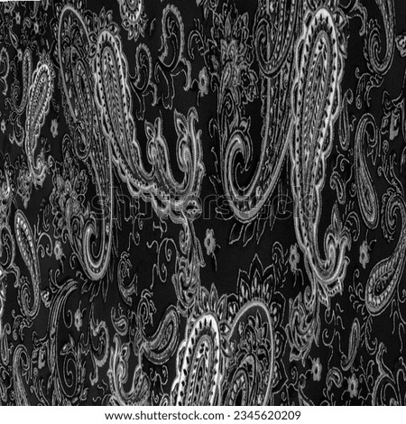 Paisley black-white pattern on a black background. decorated the bandanas of cowboys and bikers popularized by The Beatles, ushered in the era of rock and roll.