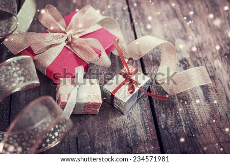 Christmas presents on dark wooden background in vintage style