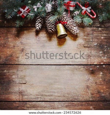 Christmas fir tree with decoration on wooden board 