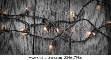 White Christmas Tree Lights with Rustic Wood Background