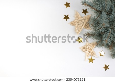 stars, decorations, spruce on a white background. Top view with copy space.