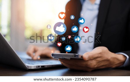 Hand holding smartphone and Social media and digital online concept, smart phone with Social media, concept of living on vacation and playing social media. Social Distancing