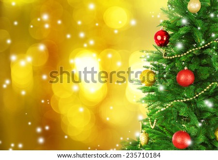 Decorated Christmas tree on festive shiny background