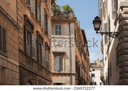 Traditional residential buildings and architecture in Rione VI Parione in central old town of historic Rome, Italy.
