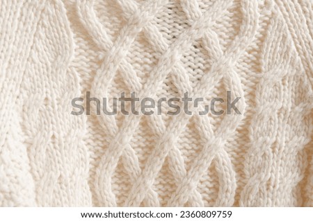 Fragment of an ornament on a knitted woolen sweater