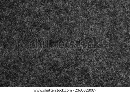 Texture and surface on an old black flannel background.
