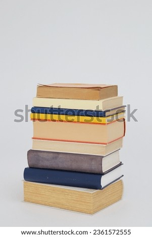 pile of colorful books isolated on white background. education and learning concept
