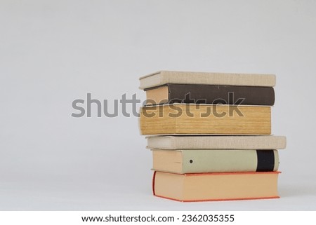 Stack of books on white background school education