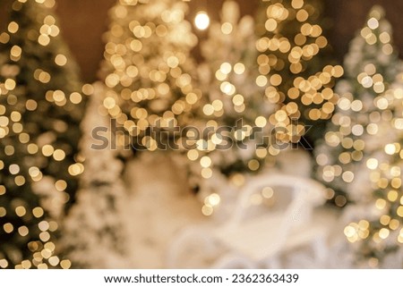 Beautiful holiday decorated room with Christmas tree and bright lights , out of focus shot for photo background.
