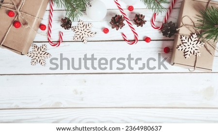 Christmas composition. Christmas gifts boxes with holiday decorations on a white wooden table. Flat lay. copy space.