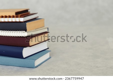 stack of books in gray background