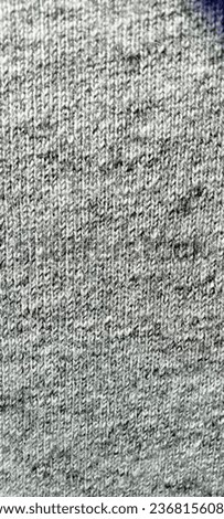 close up or detail of fabric fibers on clothes with black and white, blur effect and lack of focus