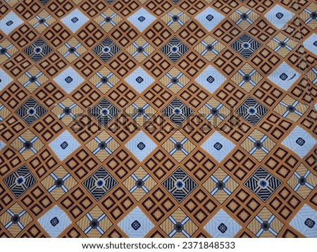 Indonesian square patterns that appears in a bed sheet.