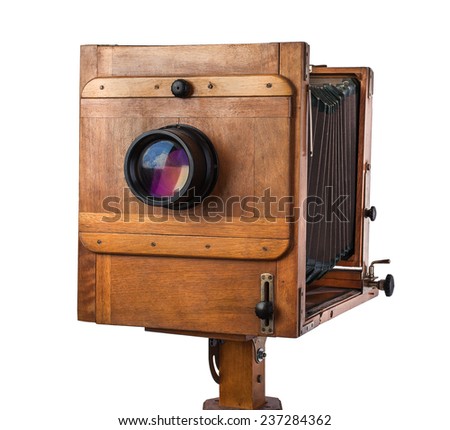 Old vintage wooden view camera isolated on white