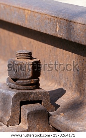 close-up of rusty iron bolts on the railway