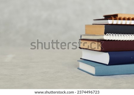 stack of books in gray background
