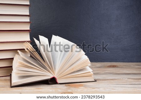 open book, books on the school board. Back to school. Education. Copy space for text