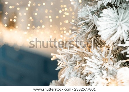 Christmas tree branches with decorations garlands, bokeh. Postcard with space for text. Merry christmas card. Winter holiday theme. Happy New Year.	