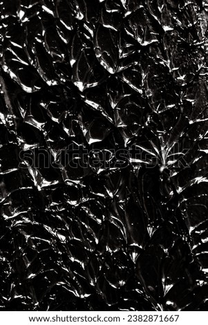 Abstract black paint on an artistic painting. Background texture of interesting terrain surface