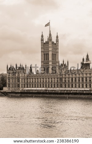 River Thames and Palace of Westminster (known as Houses of Parliament). Palace of Westminster located on bank of River Thames in City of Westminster, London. Vintage sepia photo. 