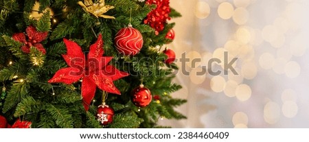 Christmas Tree with Decorations  and Gift box Near window with Light. Decorative colorful christmas balls on  pine tree with bokeh background, shallow depth of field, new year decor, merry christmas