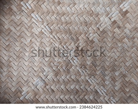 The background is made from traditional Indonesian rattan weaving 