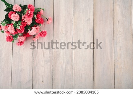 Roses are flowers. Bouquet of saffron, chrysanthemums, lilies, tulips.On a wooden background.For my birthday. Valentine's Day. for weddings.The concept of the holiday.For the designer.
