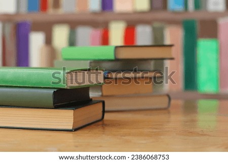 Green books on the table in library