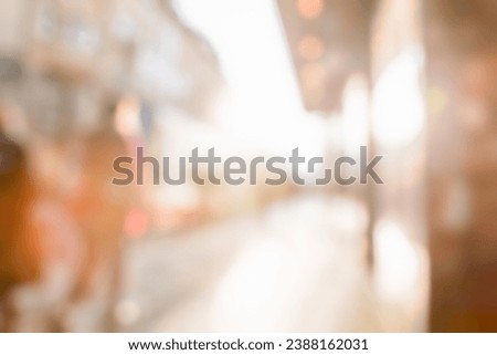 LIGHT URBAN LIFESTYLE BACKGROUND WITH PEOPLE WALKING IN CITY STREET AT SUN LIGHT, BRIGHT OUTDOOR BACKDROP
