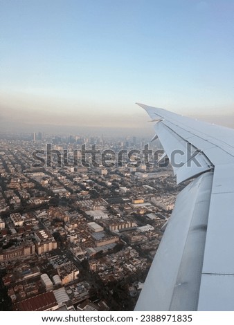 The view of vibrant Mexico City from flight window seat