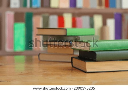 Green books on the table in library