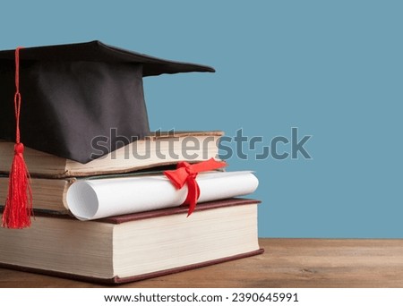 Graduation mortarboard and  stack of books. Education concept.