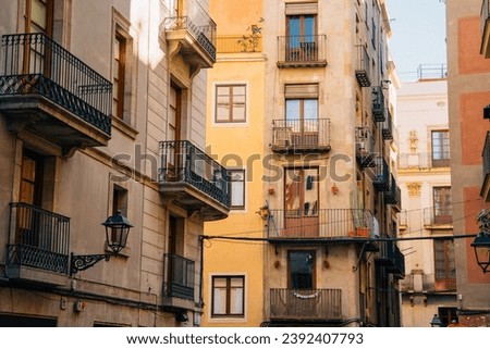 Old narrow street in Barcelona, Catalonia, Spain. Architecture and landmark of Barcelona. Cozy cityscape of Barcelona
