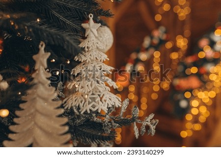 Christmas tree decorations hang on the tree