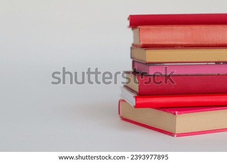 Red books on white background