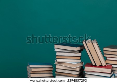 stack of books on a green background in the learning library