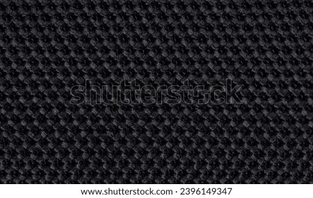 Pattern of black knit fiber nylon material  macro close up view