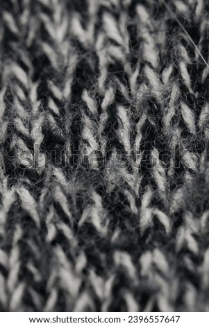 Close-up of woven black and white fibers
