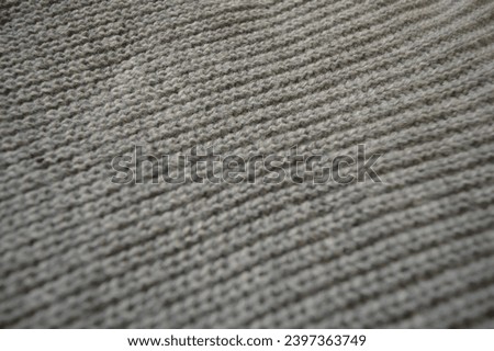 Selective focus, Fiber pattern texture of clothes made of green wool fabric, dark green fabric texture