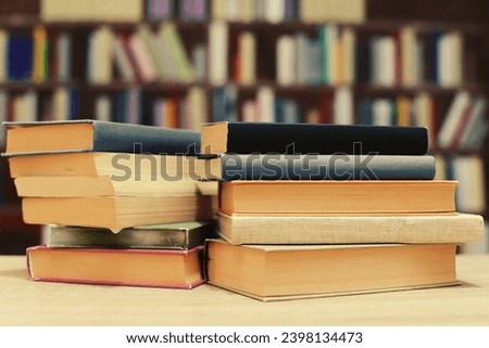 books on table in library, space for text