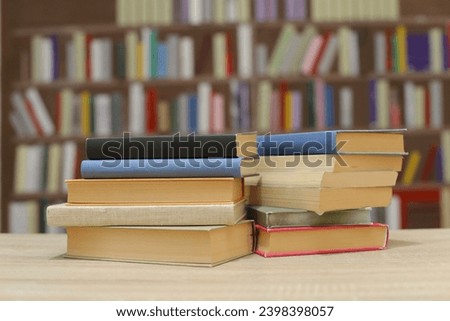 stack of books on wooden table