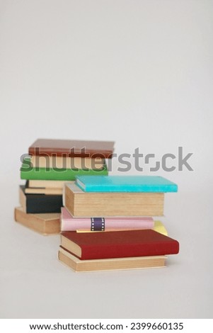 Stack of books on white background school education