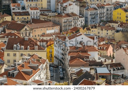 Top view of historic buildings in Lisbon downtown, Portugal. Close-up view of the Lisbon old town skyline. Historical buildings with orange tiled roofs in capital city of Portugal