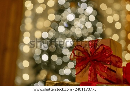 Christmas gift or present box, against magic bokeh background. Beautiful Christmas gift boxes with ribbon