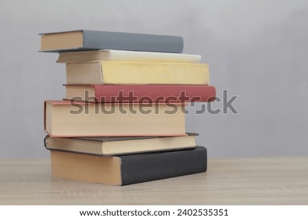 Books on the table with gray background