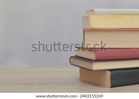 Books on the table with gray background