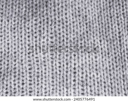 closeup gray knitted woolen fabric texture background