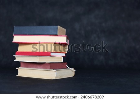 stack of books on black